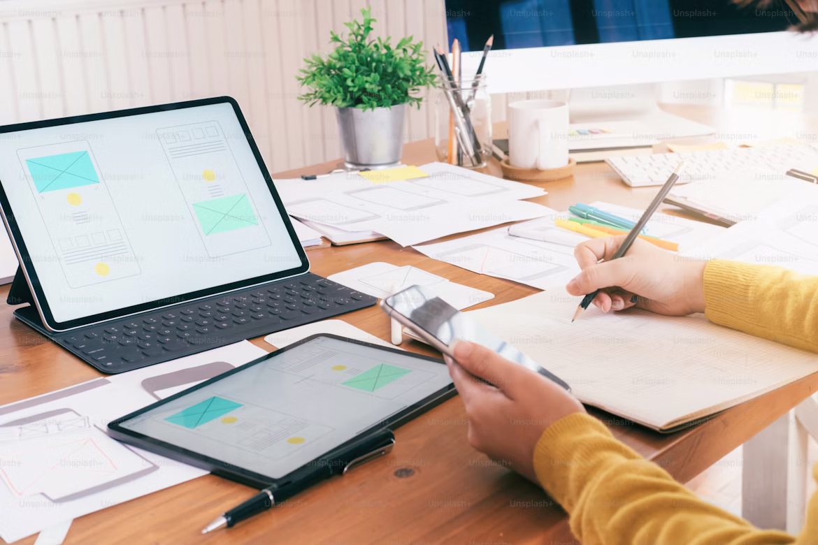 Web designer and developer comparing UI screens